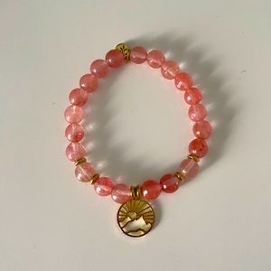 T Jazelle A New Day gold charm on watermelon quartz stone
